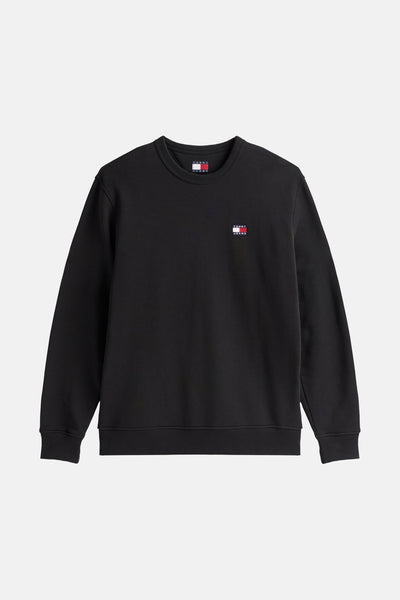 Sweat-shirt noir de TOMMY JEANS avec un logo sur la poitrine et col rond.