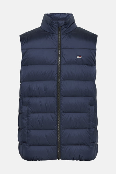 Blauwe mouwloze jas van TOMMY JEANS met volledige ritssluiting en logo op de borst.
