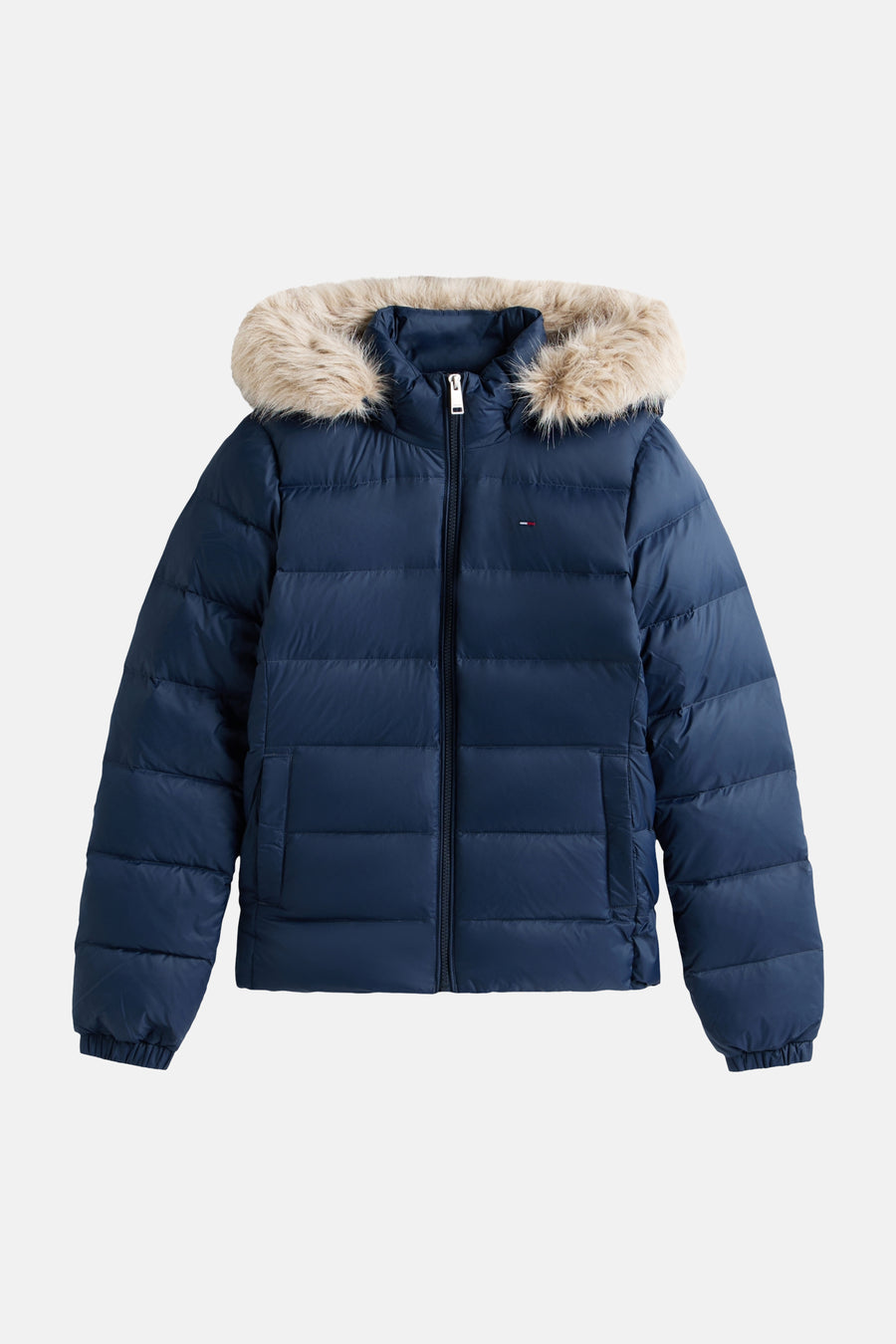 Navy blue quilted puffer jacket with faux fur hood trim, front zipper, and elastic cuffs, by Tommy Hilfiger, shown front view.