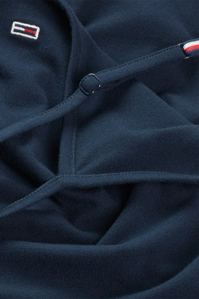 Débardeur bleu marine par Tommy Jeans avec fines bretelles, logo brodé et dos croisé.