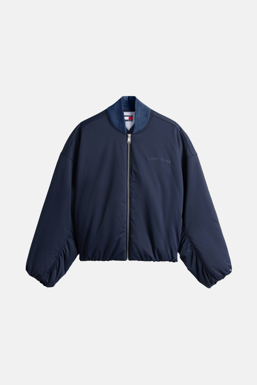 Veste courte bleue de TOMMY JEANS avec fermeture éclair centrale et manches froncées