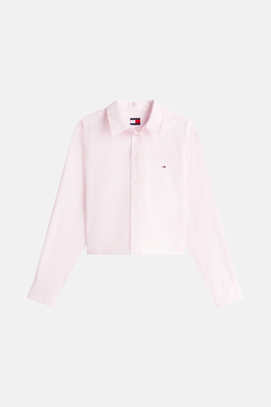 Roze blouse met lange mouwen van TOMMY JEANS, met discreet logo en korte pasvorm.