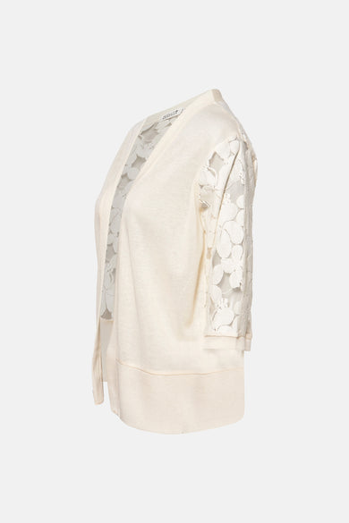 Gilet van Molly Bracken, met bloemlelelle mouwen.