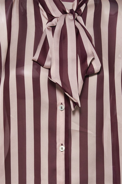 Blouse multicolore de AMELIE ET AMELIE avec motif rayé vertical et nœud décoratif sur le devant.