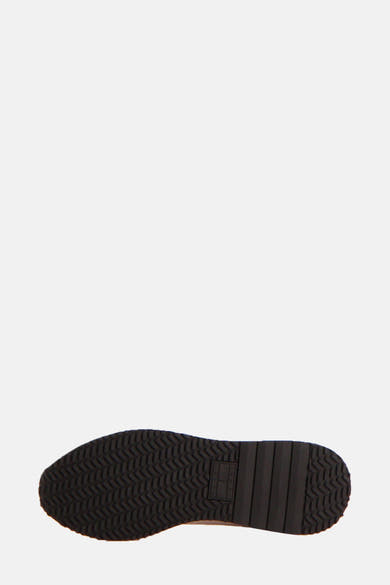 Zwarte sneakerzool van Tommy Jeans met visgraatpatroon.
