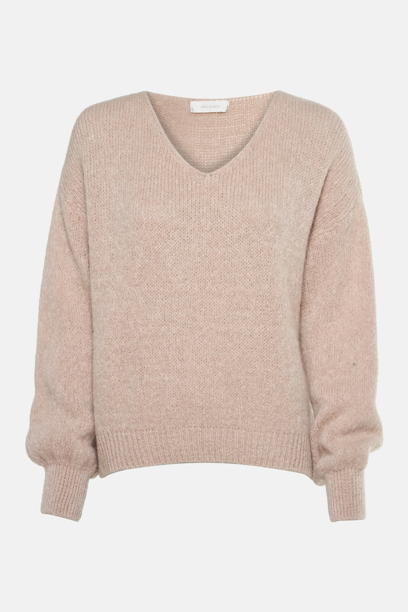 Pull beige à col en V d'AMÉLIE ET AMÉLIE, en tricot texturé à manches longues bouffantes.