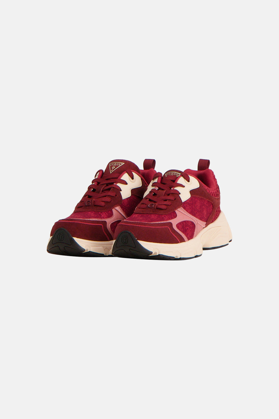 Red and cream chunky sneakers by Guess with suede texture, black toe caps, and side branding, front view