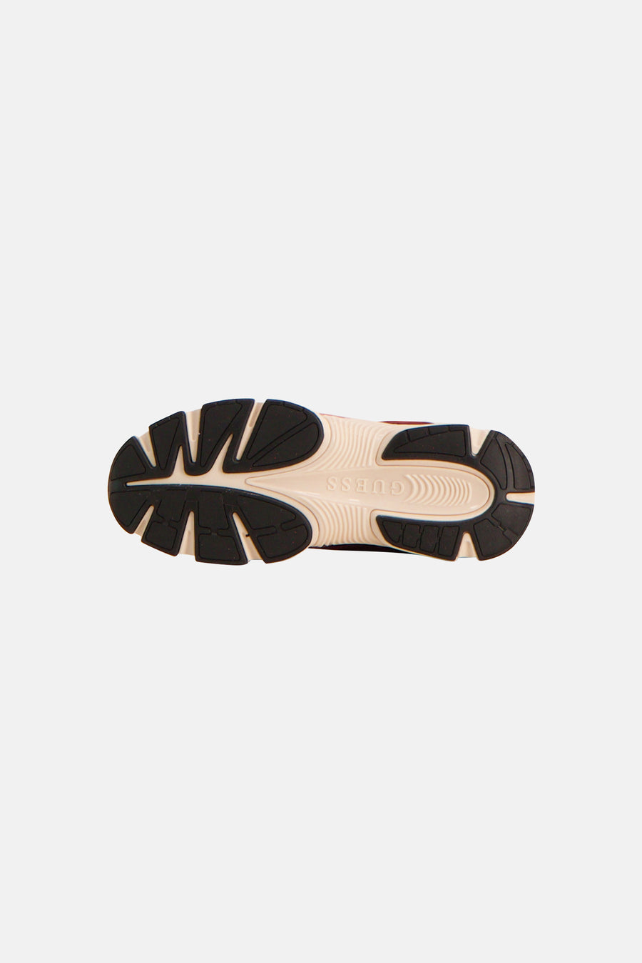Red sneakers by Guess, bottom view showing black and beige textured sole with brand logo embossed.