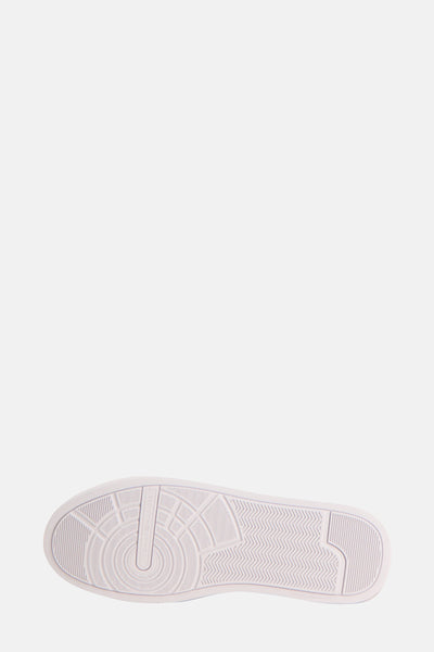 Witte basketzool van Tommy Jeans met antislip textuurpatroon.
