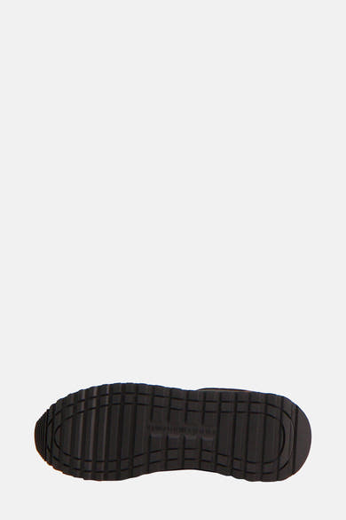 Bruine TOMMY JEANS-sneakers, zool met zichtbare groeven.