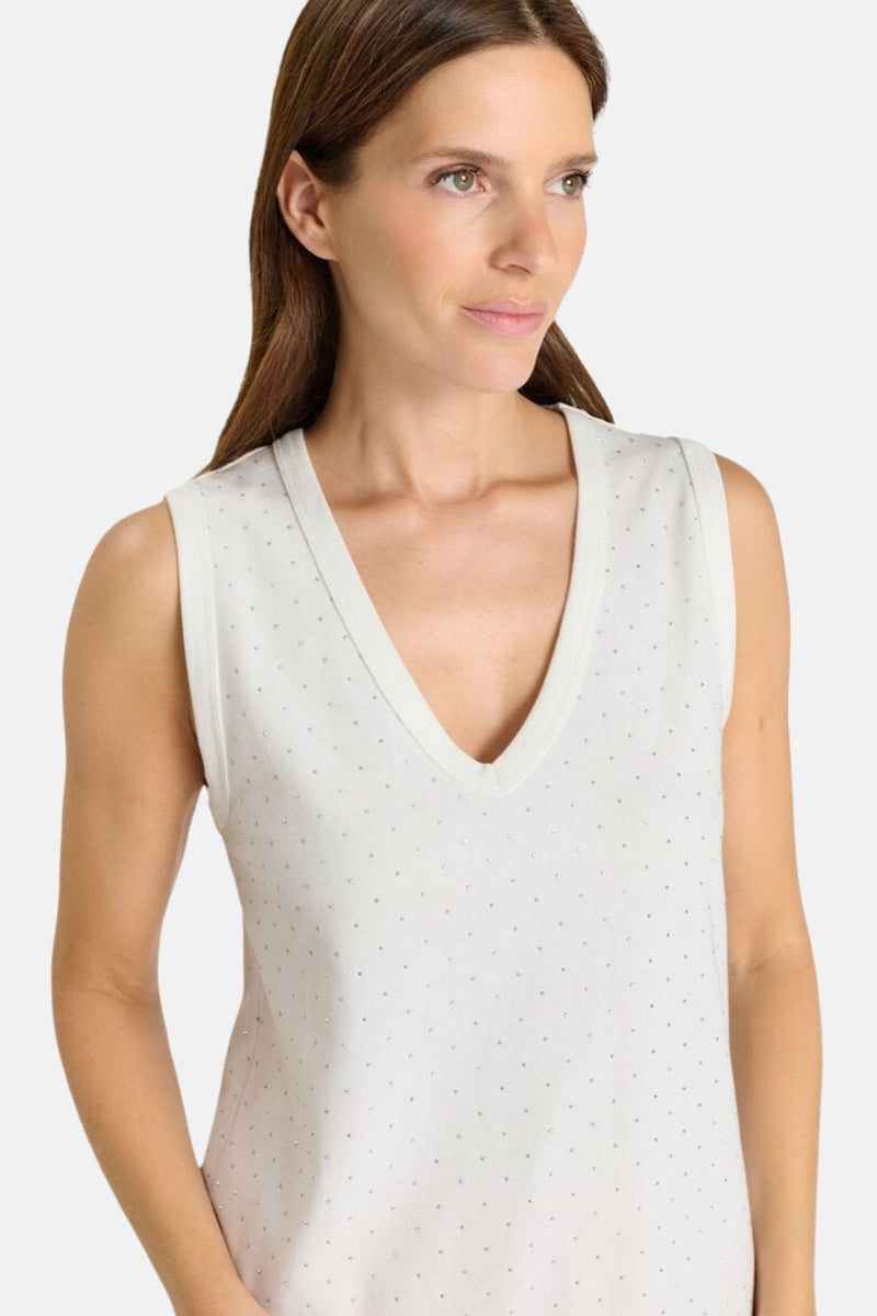 Top sans manches blanc par Le Temps des Cerises, orné de motifs à pois scintillants, coupe en V.
