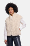 Écru shearling bodywarmer by RINO PELLE, soft curly texture, worn over white shirt with black leather pants, front view