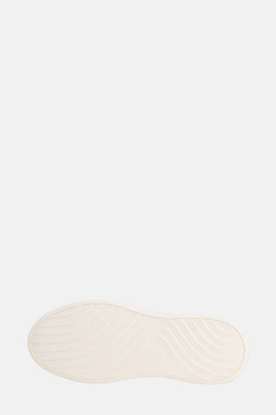 Semelle de baskets blanche de Tommy Jeans, avec motif texturé ondulé.