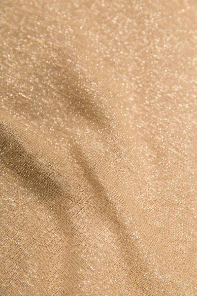 Golden shimmer short-sleeve t-shirt with glittery texture, close-up fabric detail
