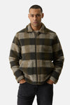 Khaki plaid fleece jacket with front zipper and two patch pockets, worn by model in lifestyle front view