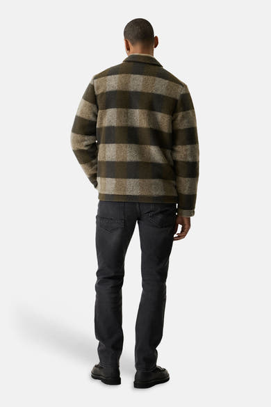 Khaki plaid wool-blend casual jacket from back view, featuring olive and beige check pattern, worn with dark jeans and black shoes