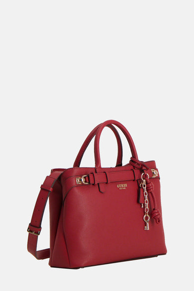 Rode handtas van imitatieleer van Guess met schouderriem en decoratieve bedel.