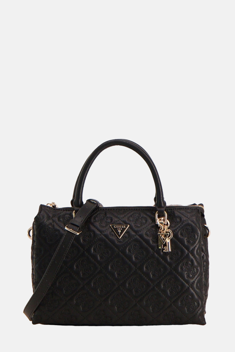 Zwarte Guess handtas, met een gewatteerd patroon en decoratieve gouden bedeltjes.