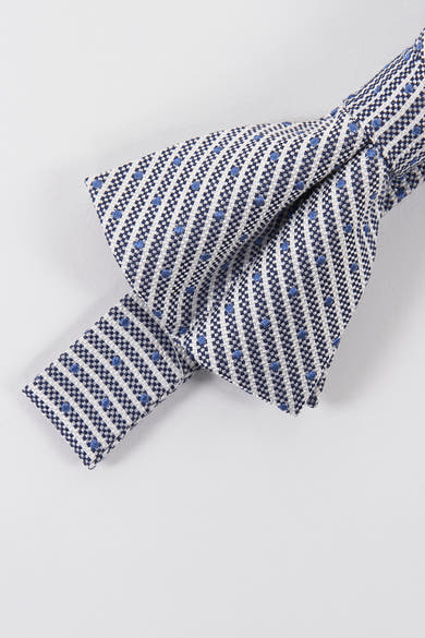 Nœud papillon bleu à motifs graphiques de Le Fabuleux Marcel de Bruxelles avec pois bleus.