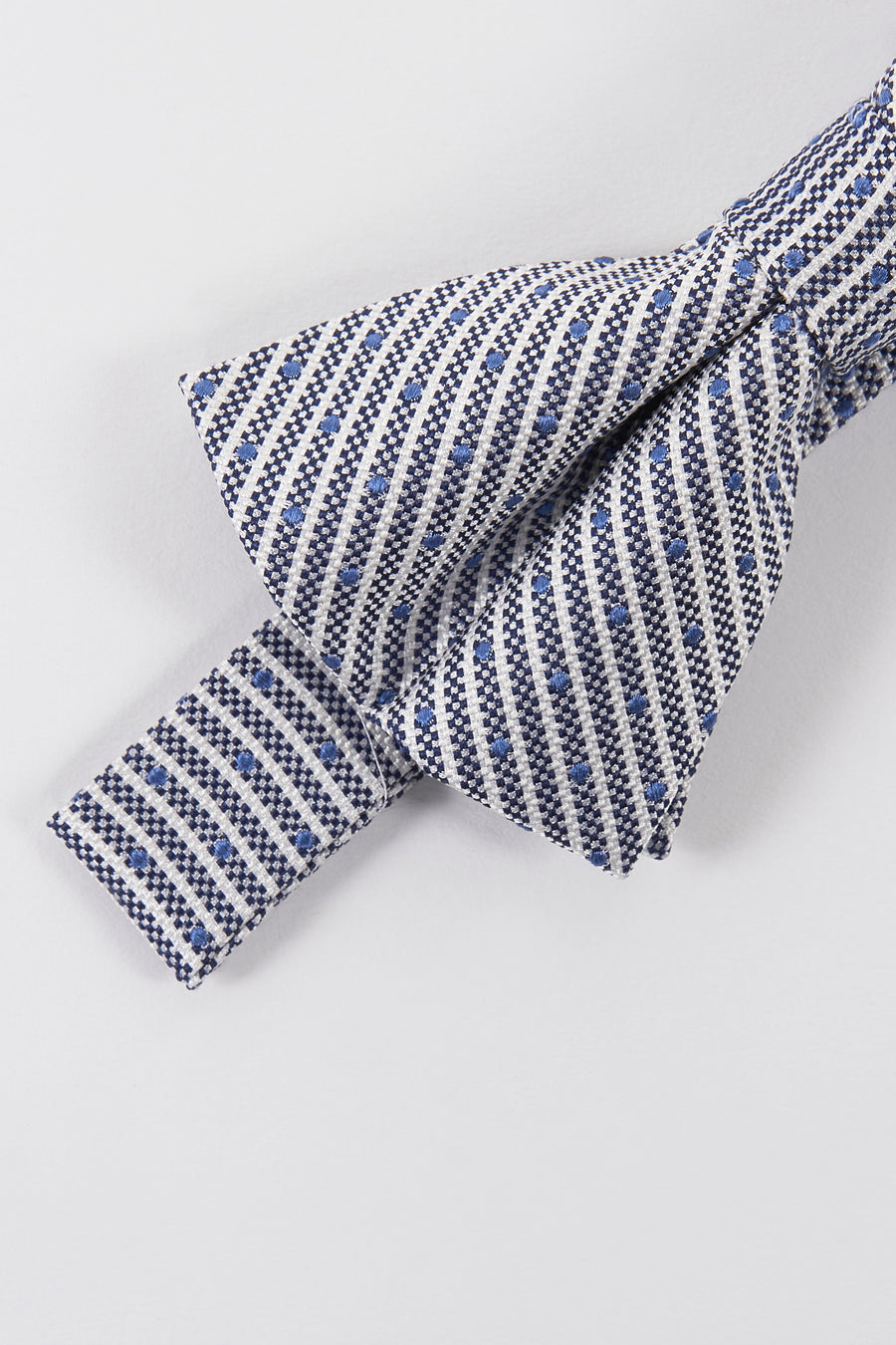 Nœud papillon bleu à motifs graphiques de Le Fabuleux Marcel de Bruxelles avec pois bleus.