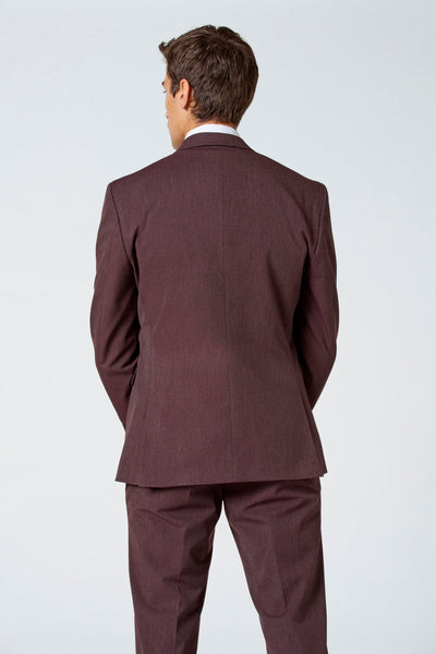 Blazer brun de Le Fabuleux Marcel de Bruxelles, coupe ajustée, vue de dos, porté avec une chemise blanche.