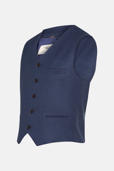 Marineblauwe bodywarmer van Le Fabuleux Marcel de Bruxelles, met bruine knopen en een paspelzak op de borst.