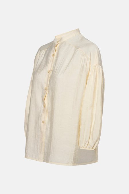 Gele blouse met lange mouwen van AMELIE ET AMELIE, met een subtiele textuur en een centrale knoopsluiting.