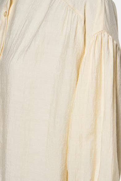 Gele blouse met lange mouwen van AMELIE ET AMELIE, met pofmouwen en subtiele textuur.