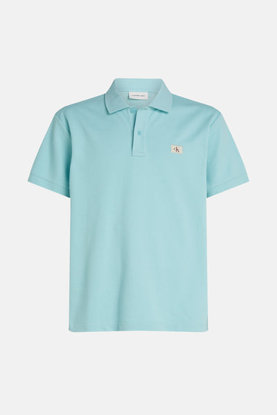 Turquoise poloshirt met korte mouwen van Calvin Klein Jeans met logo op de borst.