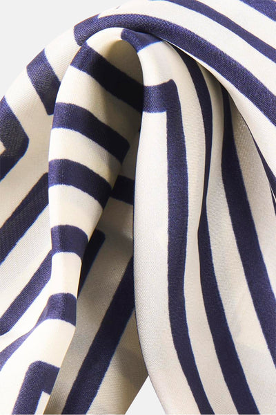 Beige foulard with navy and cream vertical stripes, smooth fabric texture, close-up view