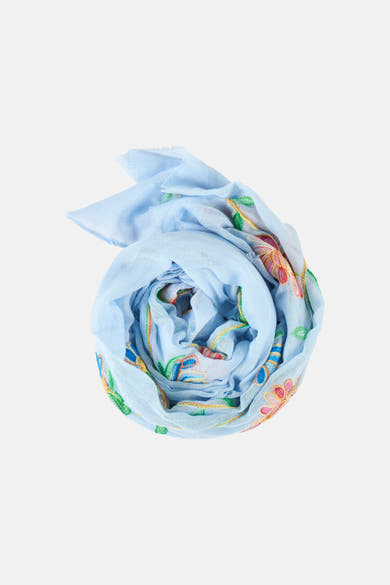 Foulard bleu Access®, enroulé en spirale, avec motifs floraux brodés multicolores.
