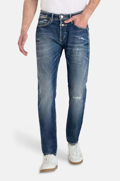 Jean slim en denim bleu foncé de Le Temps des Cerises, avec effet usé et délavé.