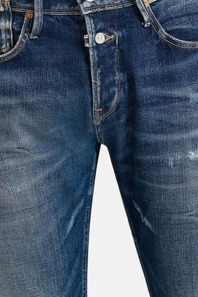 Slim jeans in donkerblauw denim van Le Temps des Cerises, met versleten en uitgewassen details.