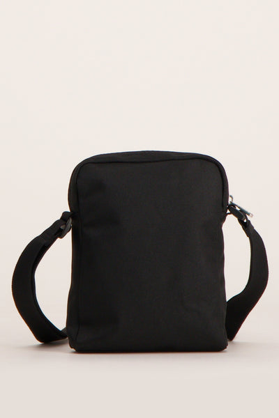 Sac à bandoulière noir de Calvin Klein, avec une bandoulière réglable et une texture lisse.