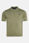 Groen poloshirt met korte mouwen van Fred Perry, met geborduurd logo op de borst.