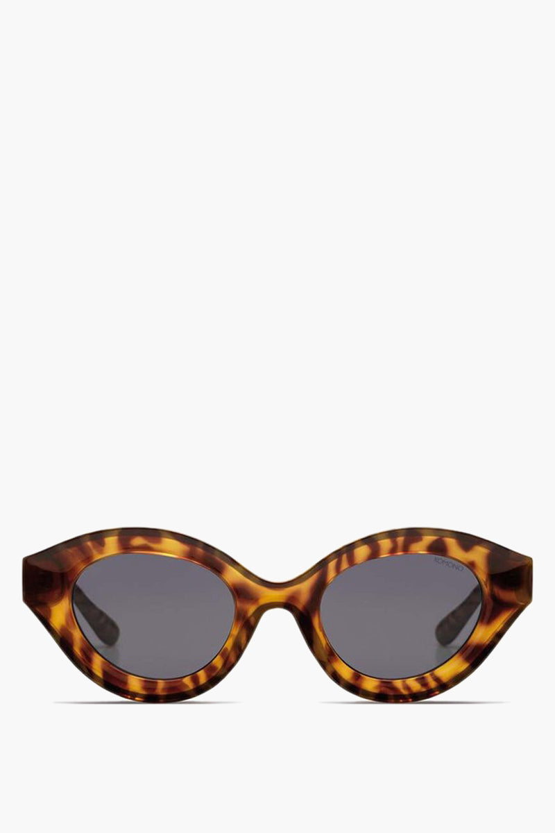 Lunettes de soleil écaille de tortue, de KOMONO, avec des verres gris foncé.