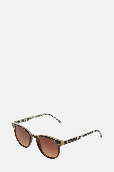Lunettes de soleil marron, par KOMONO, avec une monture à motif écaille de tortue.