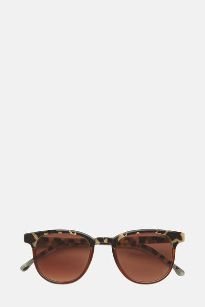 Lunettes de soleil marron, de KOMONO, avec monture à motif léopard et verres dégradés.