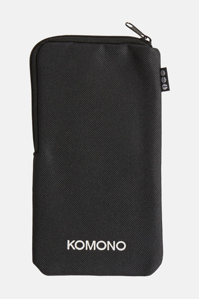 Zwarte Komono hoes, met ritssluiting en een getextureerd patroon.