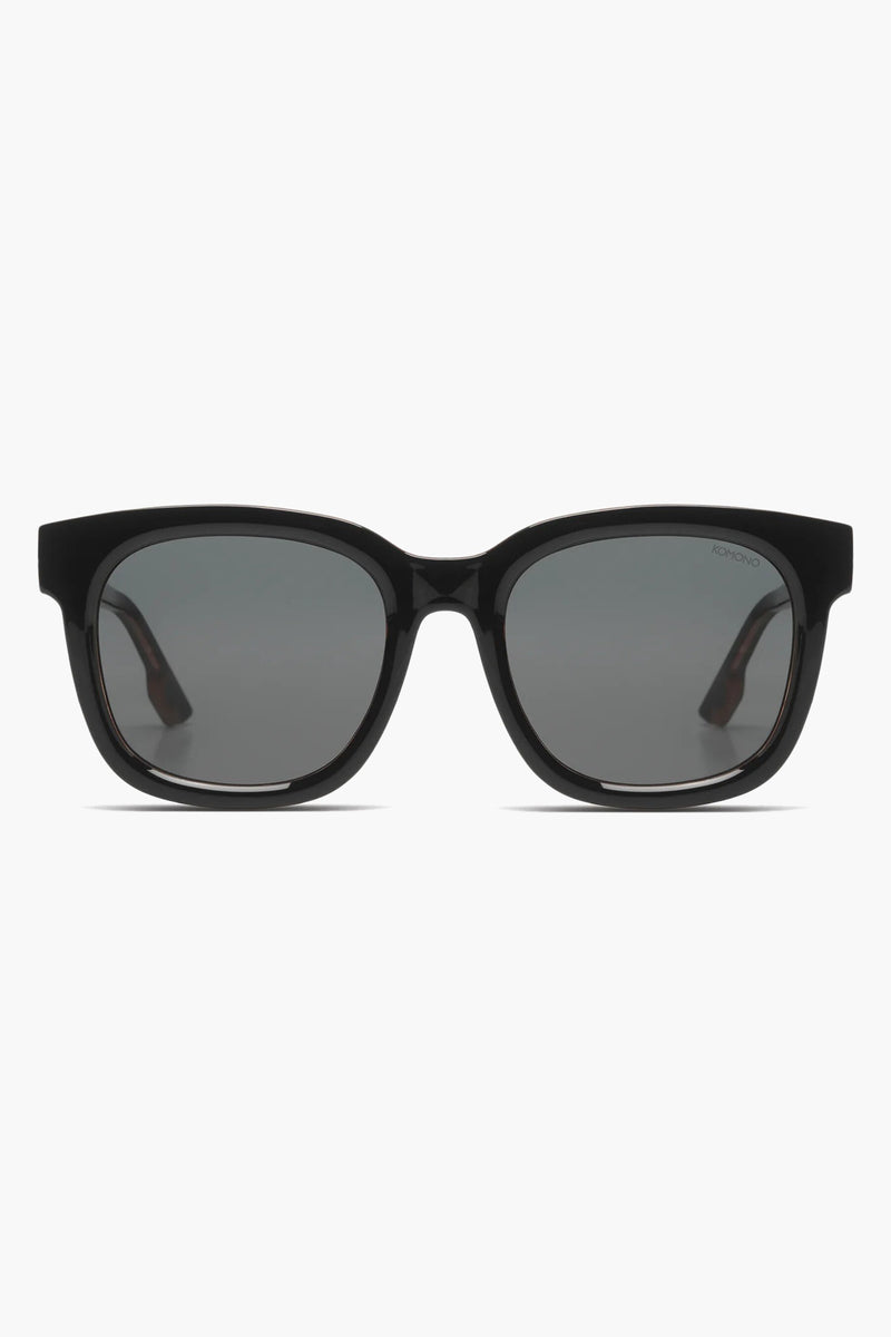 Lunettes de soleil noires de KOMONO, monture carrée, verres fumés.