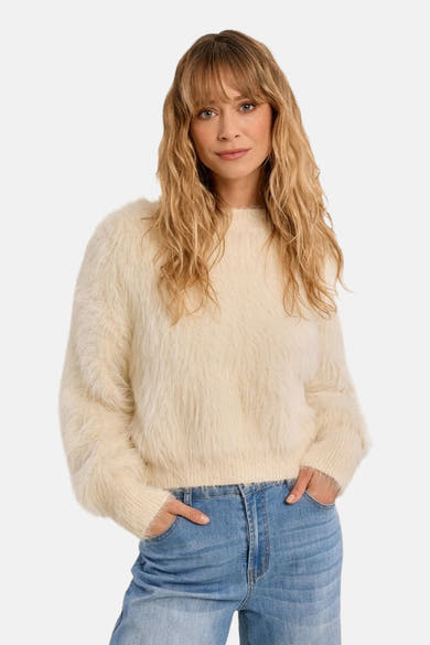 Ecru fuzzy crewneck sweater with soft textured knit, worn with blue jeans, front view