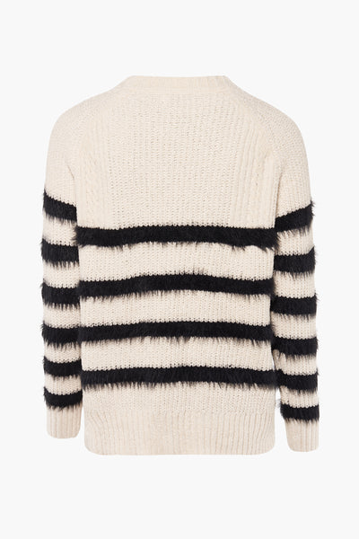 Pull à col rond blanc par Molly Bracken, à rayures horizontales noires en fausse fourrure.