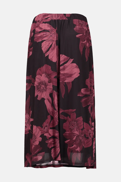 Jupe 3/4 multicolore de ZABAIONE avec un motif floral bordeaux sur fond noir.