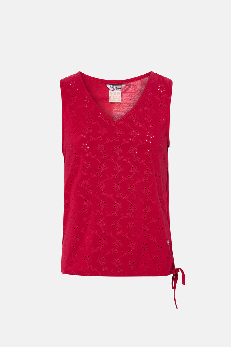 Top sans manches rose de ZABAIONE, à motif ajouré fleuri sur l'ensemble et cordon noué sur le côté.
