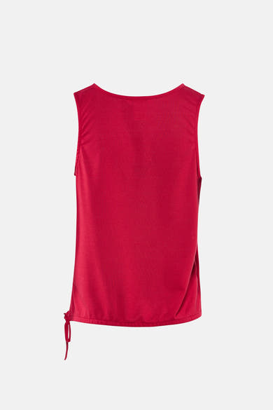Top rose sans manches de Zabaione, avec cordon de serrage sur le côté et texture chinée.