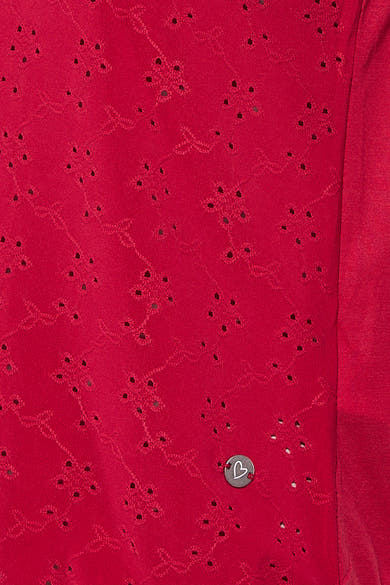 Top rose de Zabaione avec motif ajouré et détail de bouton métallique en forme de cœur.