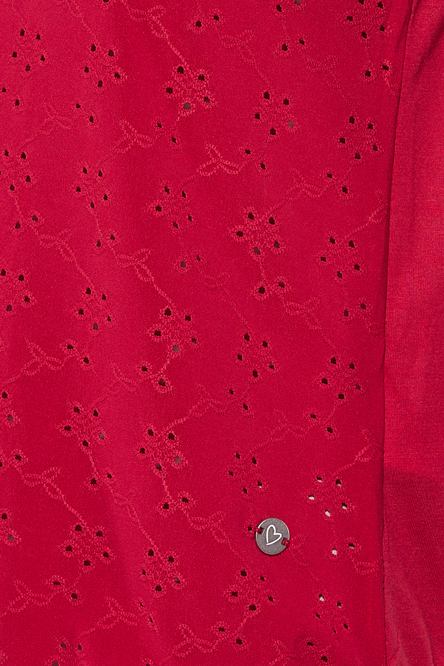 Top rose de Zabaione avec motif ajouré et détail de bouton métallique en forme de cœur.