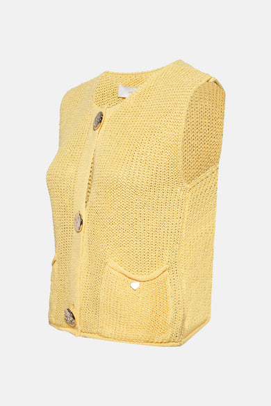 Gilet jaune in maille door AMELIE ET AMELIE, met decoratieve knoppen en een genaaidde.