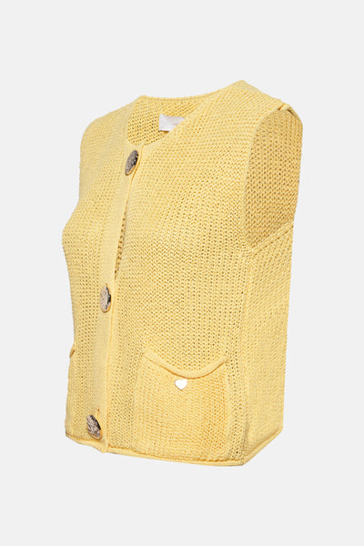 Gilet jaune in maille door AMELIE ET AMELIE, met decoratieve knoppen en een genaaidde.