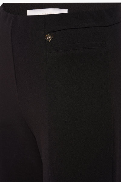 Slechte passende AMELIE ET AMELIE pantalon, met een gouden hartvormige decoratieve details.